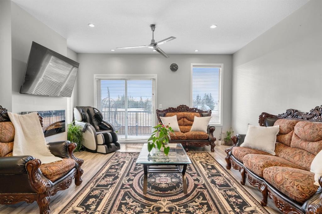 2001-280 Williamstown Close Nw, Airdrie, AB - Indoor Photo Showing Living Room With Fireplace