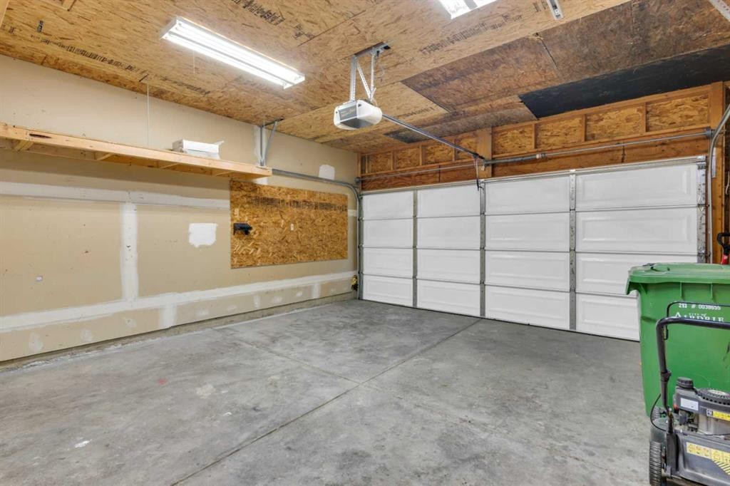 103 Canoe Square Sw, Airdrie, AB - Indoor Photo Showing Garage