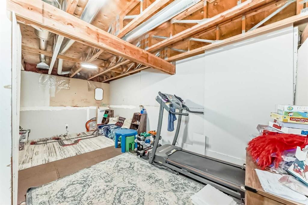 21 Woodfern Road Sw, Calgary, AB - Indoor Photo Showing Gym Room