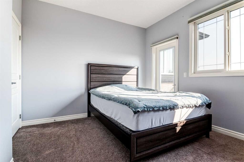 14 Marquis Heights Se, Calgary, AB - Indoor Photo Showing Bedroom