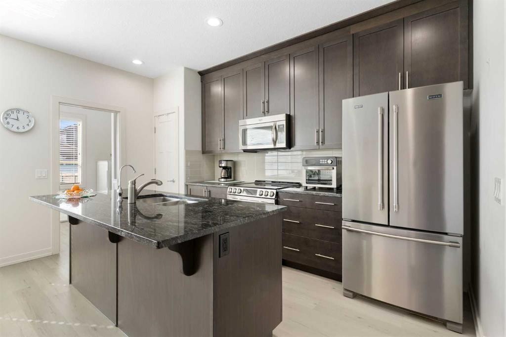 167 Fireside Drive, Cochrane, AB - Indoor Photo Showing Kitchen With Stainless Steel Kitchen With Upgraded Kitchen