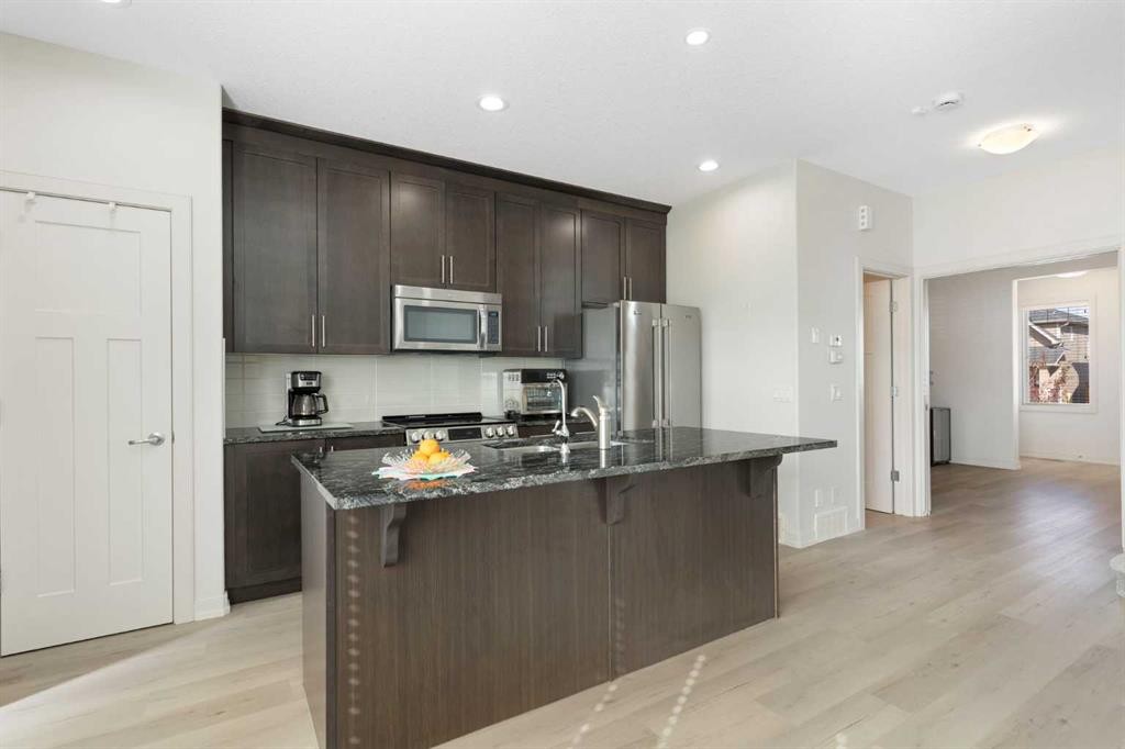 167 Fireside Drive, Cochrane, AB - Indoor Photo Showing Kitchen With Stainless Steel Kitchen With Upgraded Kitchen