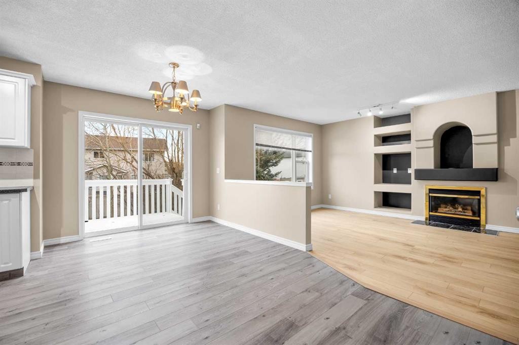 635 Panorama Hills Drive Nw, Calgary, AB - Indoor Photo Showing Living Room With Fireplace