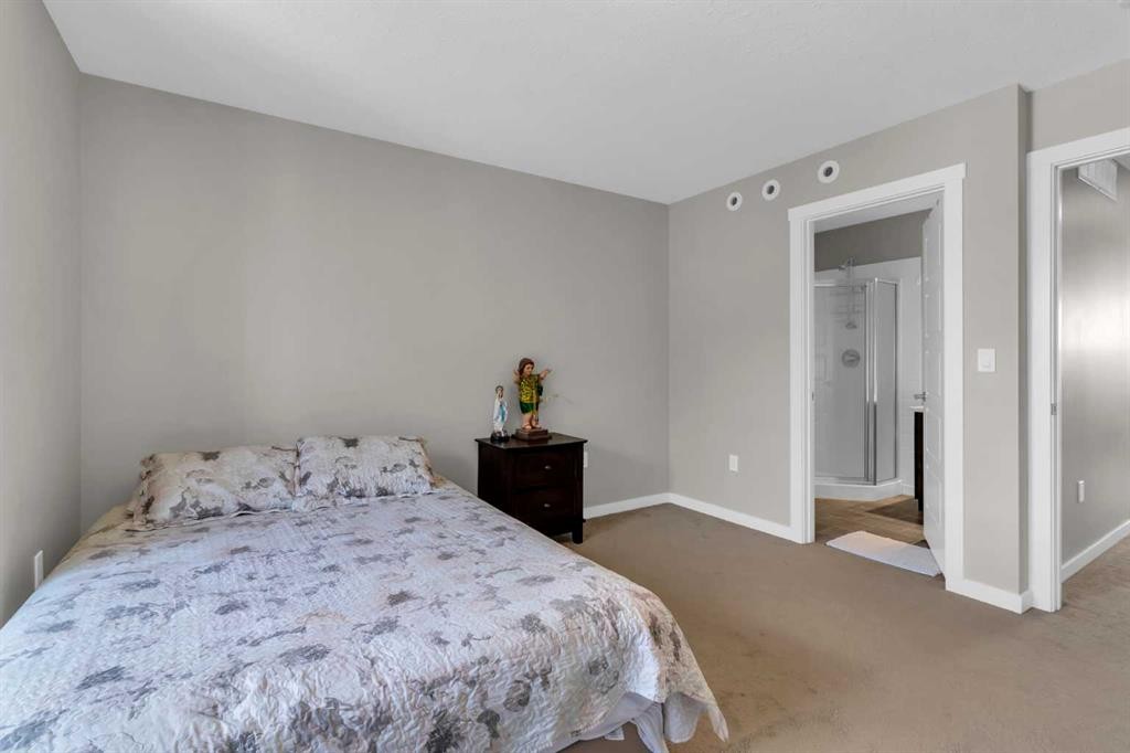 142 Red Embers Gate Ne, Calgary, AB - Indoor Photo Showing Bedroom