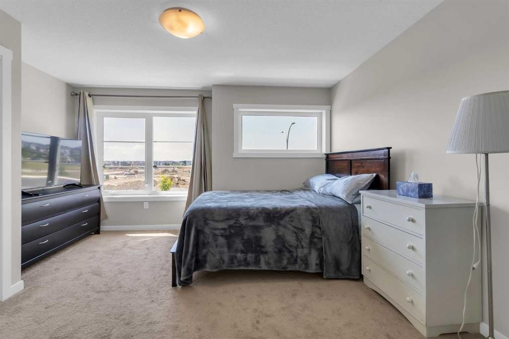 142 Red Embers Gate Ne, Calgary, AB - Indoor Photo Showing Bedroom