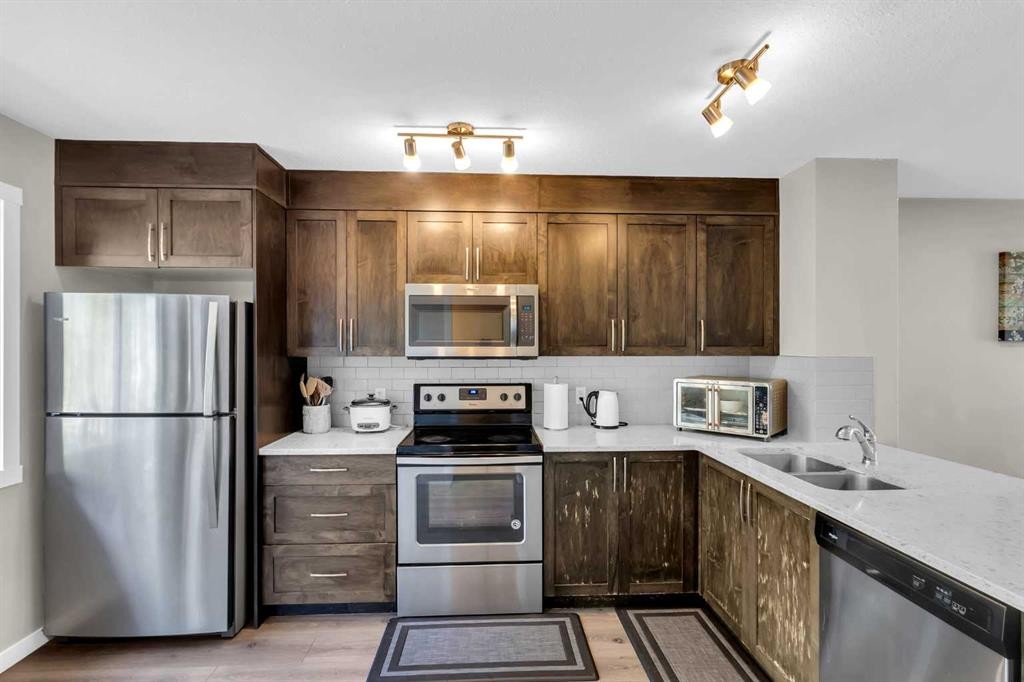 142 Red Embers Gate Ne, Calgary, AB - Indoor Photo Showing Kitchen With Stainless Steel Kitchen With Double Sink