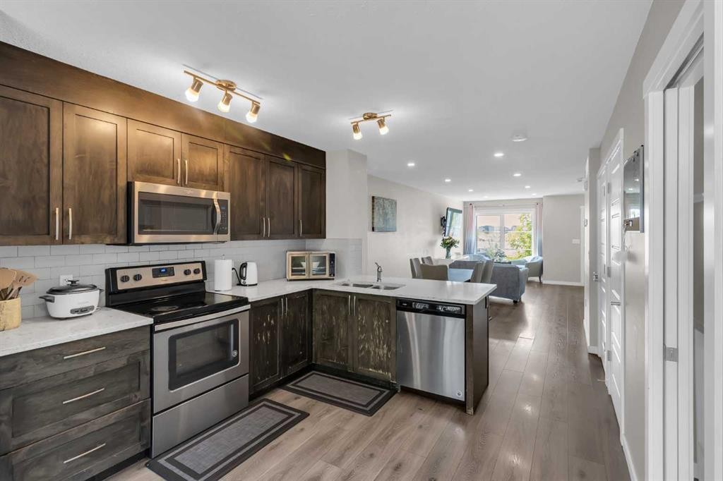 142 Red Embers Gate Ne, Calgary, AB - Indoor Photo Showing Kitchen With Stainless Steel Kitchen With Double Sink With Upgraded Kitchen