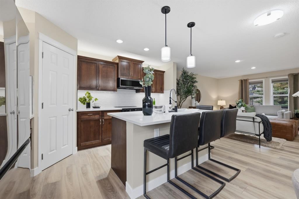 117 Panatella Park Nw, Calgary, AB - Indoor Photo Showing Kitchen With Upgraded Kitchen