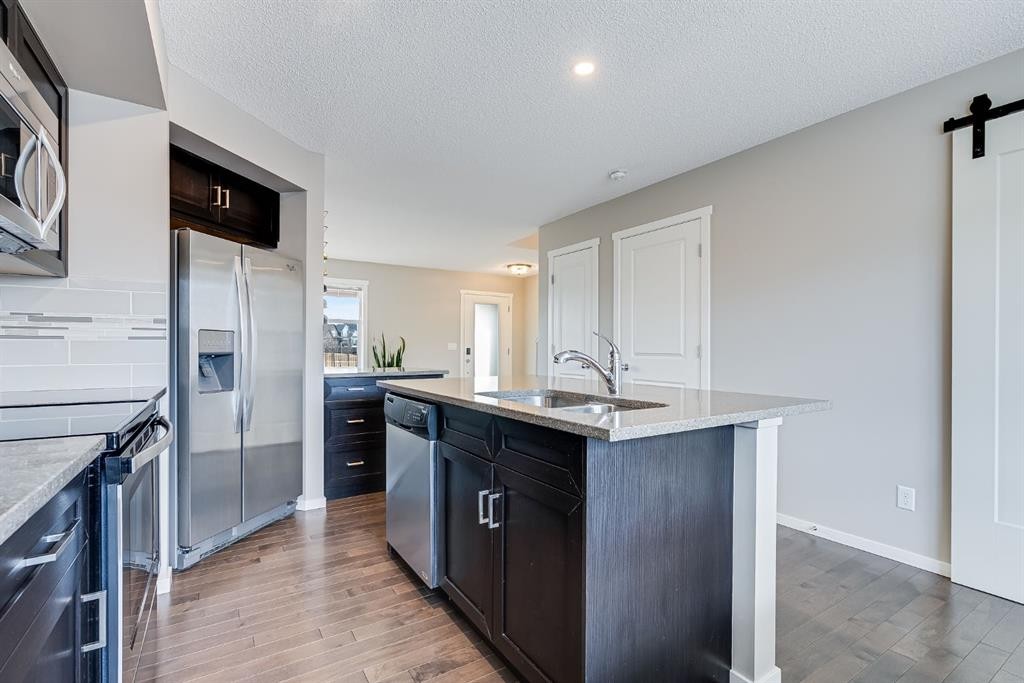 121 Marine Drive Se, Calgary, AB - Indoor Photo Showing Kitchen With Double Sink With Upgraded Kitchen