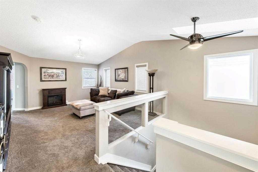 285 Evanspark Gardens Nw, Calgary, AB - Indoor Photo Showing Other Room With Fireplace