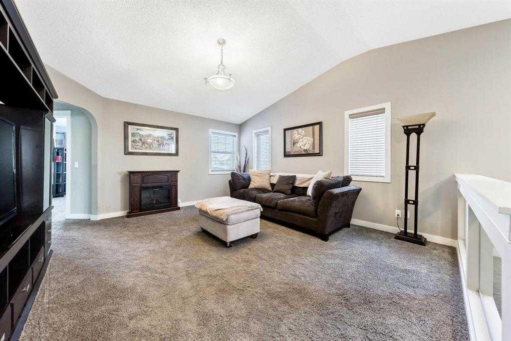 285 Evanspark Gardens Nw, Calgary, AB - Indoor Photo Showing Other Room With Fireplace