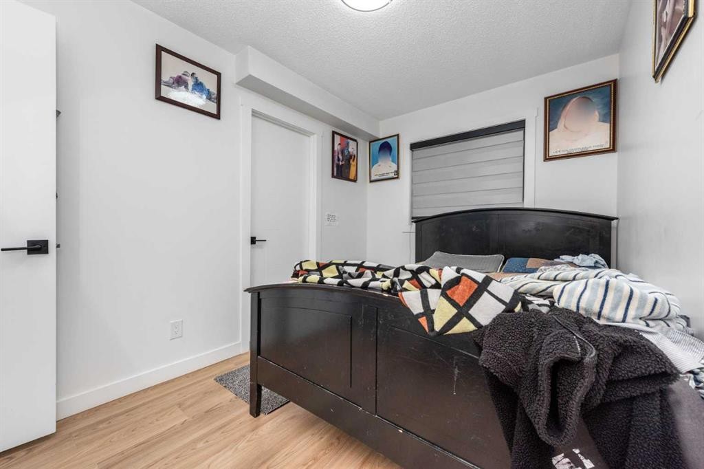 133 Woodbrook Road Sw, Calgary, AB - Indoor Photo Showing Bedroom