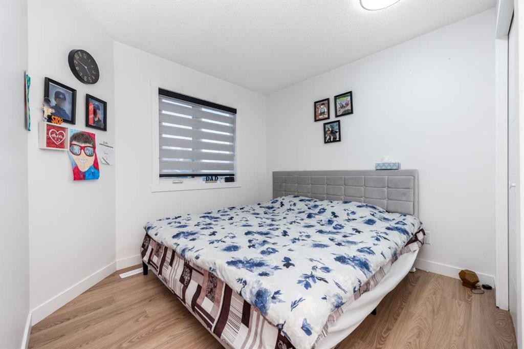 133 Woodbrook Road Sw, Calgary, AB - Indoor Photo Showing Bedroom