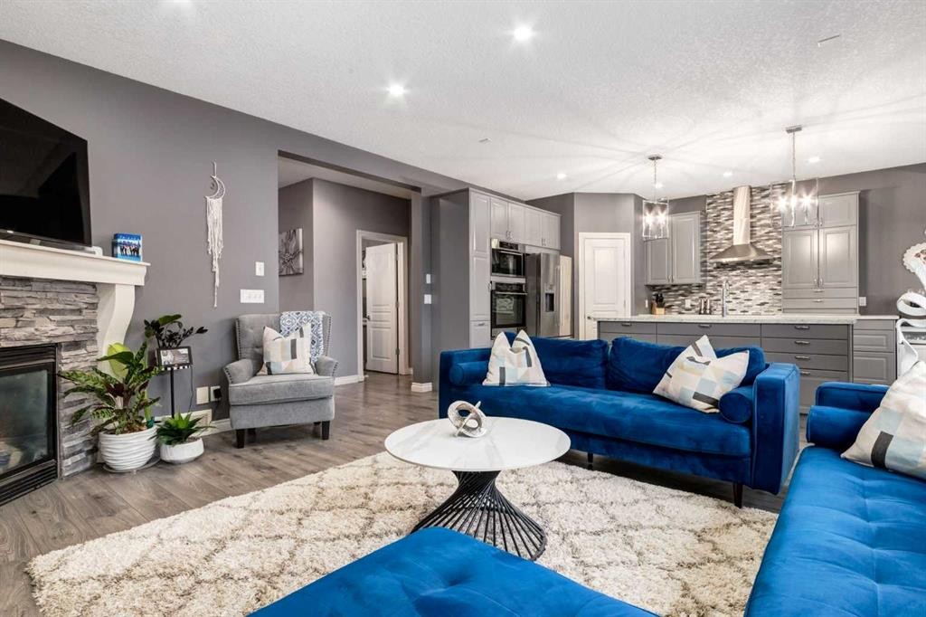 107 Evansbrooke Manor Nw, Calgary, AB - Indoor Photo Showing Living Room With Fireplace