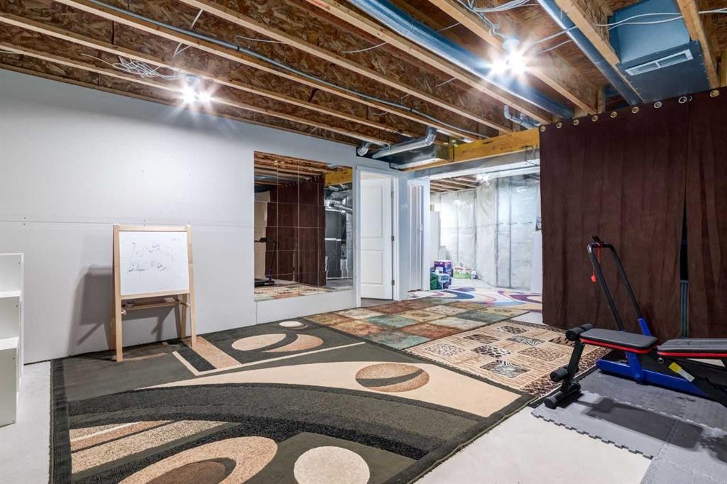 107 Evansbrooke Manor Nw, Calgary, AB - Indoor Photo Showing Basement