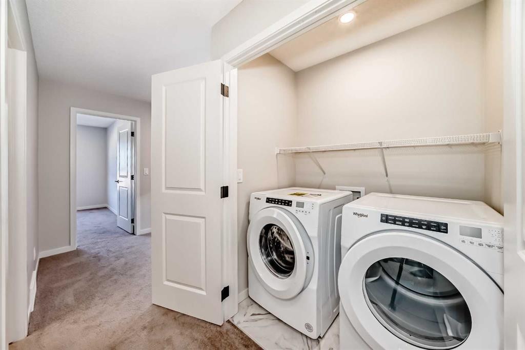 535 Tekarra Drive Nw, Calgary, AB - Indoor Photo Showing Laundry Room