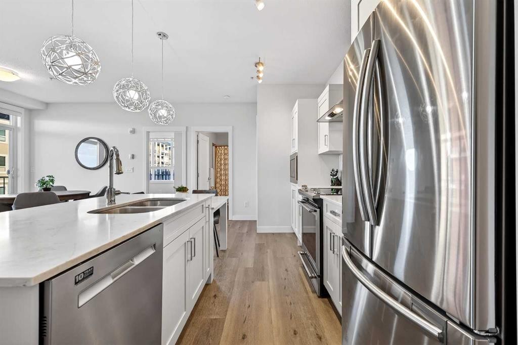 218-30 Walgrove Walk Se, Calgary, AB - Indoor Photo Showing Kitchen With Stainless Steel Kitchen With Double Sink With Upgraded Kitchen