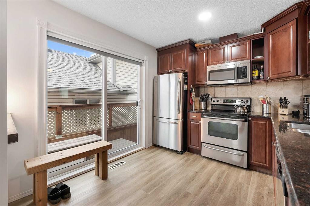 192 Rivercrest Close Se, Calgary, AB - Indoor Photo Showing Kitchen With Double Sink