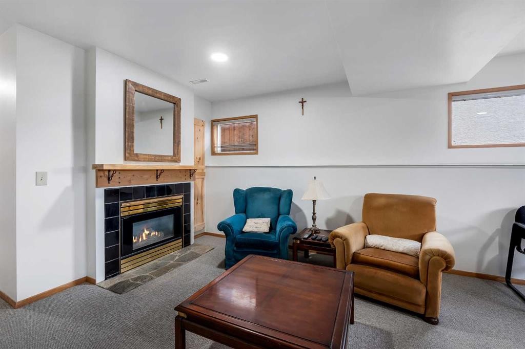 192 Rivercrest Close Se, Calgary, AB - Indoor Photo Showing Living Room With Fireplace