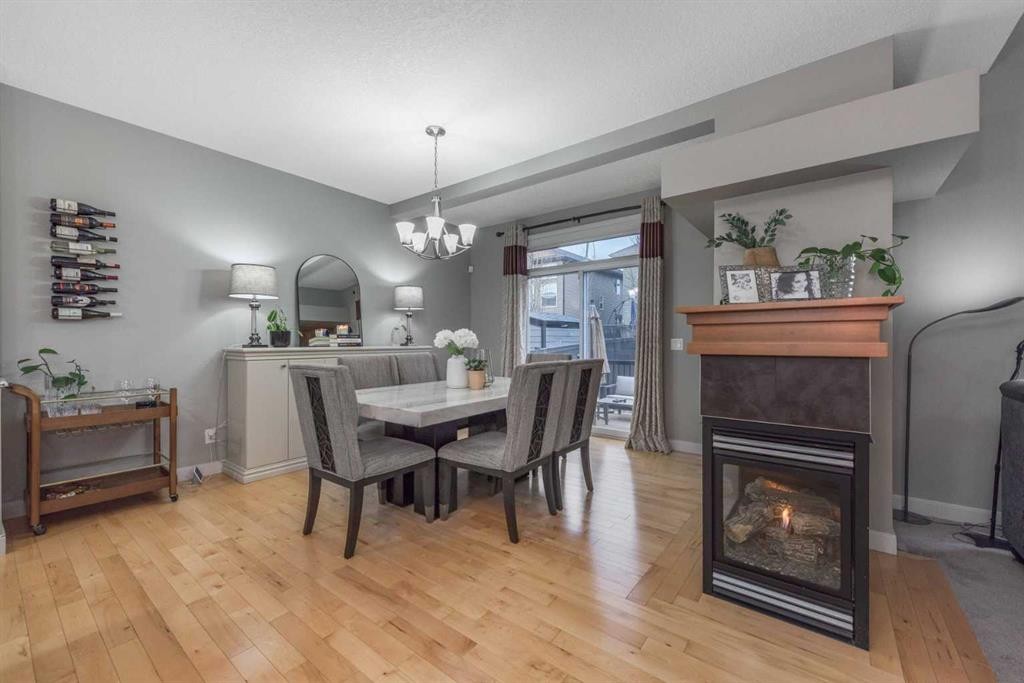 76 Evanspark Circle Nw, Calgary, AB - Indoor Photo Showing Other Room With Fireplace