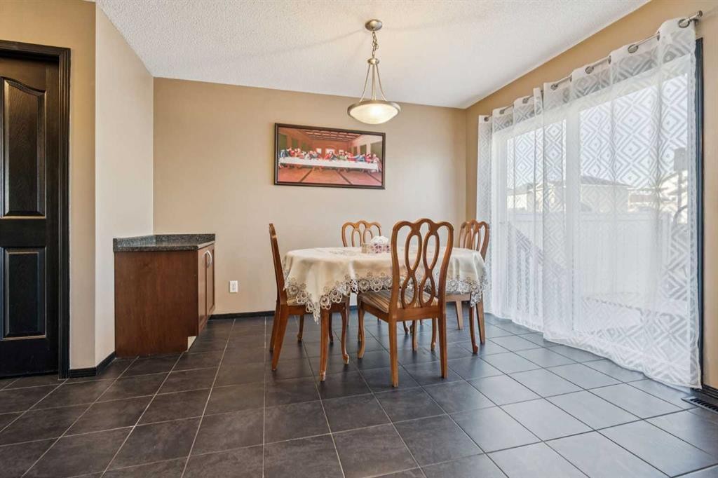 110 Eversyde Common Sw, Calgary, AB - Indoor Photo Showing Dining Room
