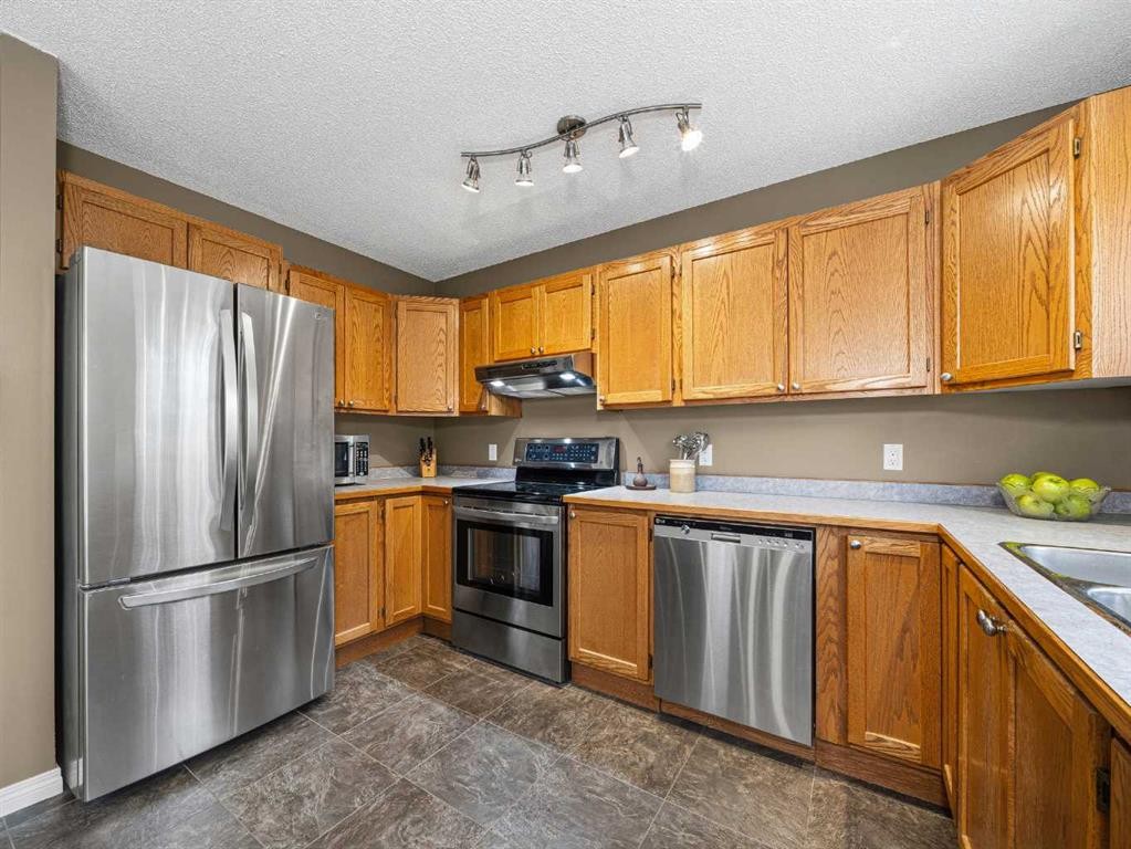 301 Arbour Cliff Close Nw, Calgary, AB - Indoor Photo Showing Kitchen With Stainless Steel Kitchen