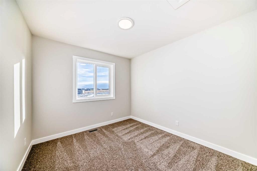 241 Bridgeport Gate, Chestermere, AB - Indoor Photo Showing Other Room