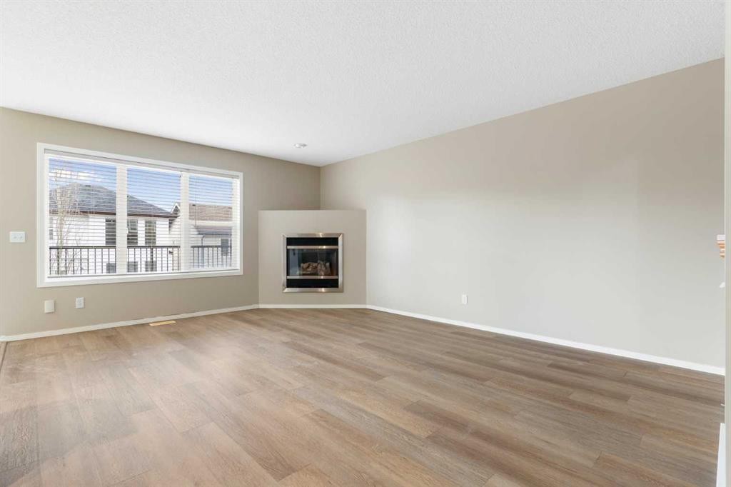 129 Evansbrooke Way Nw, Calgary, AB - Indoor Photo Showing Living Room With Fireplace