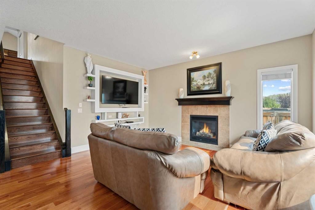113 Aspen Stone Place Sw, Calgary, AB - Indoor Photo Showing Living Room With Fireplace
