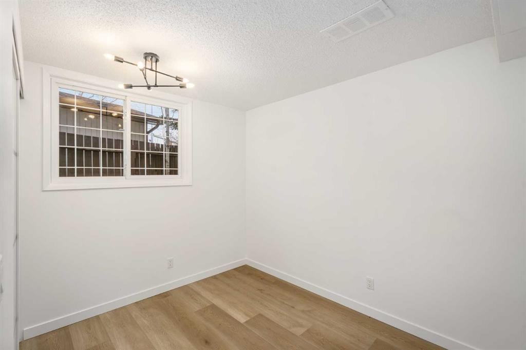 15 A Arlington Bay Se, Calgary, AB - Indoor Photo Showing Other Room