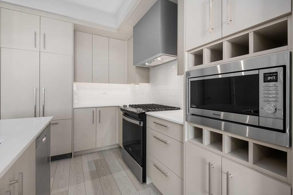 612-8230 Broadcast Avenue, Calgary, AB - Indoor Photo Showing Kitchen With Upgraded Kitchen