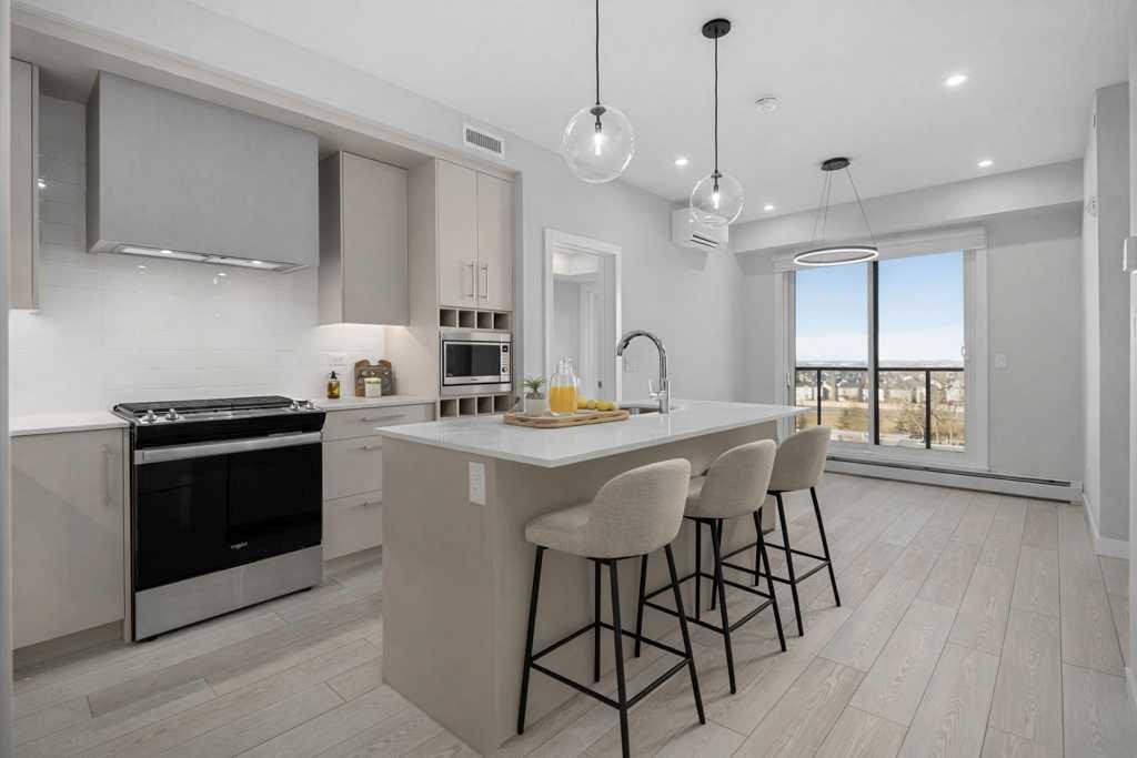 612-8230 Broadcast Avenue, Calgary, AB - Indoor Photo Showing Kitchen With Upgraded Kitchen