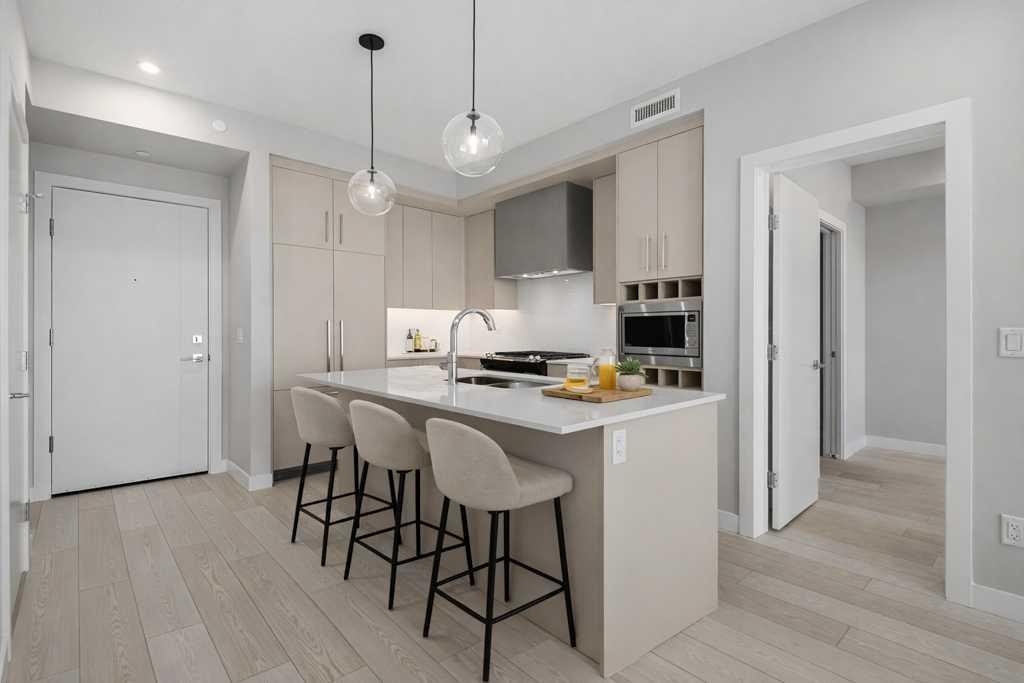 612-8230 Broadcast Avenue, Calgary, AB - Indoor Photo Showing Kitchen With Upgraded Kitchen
