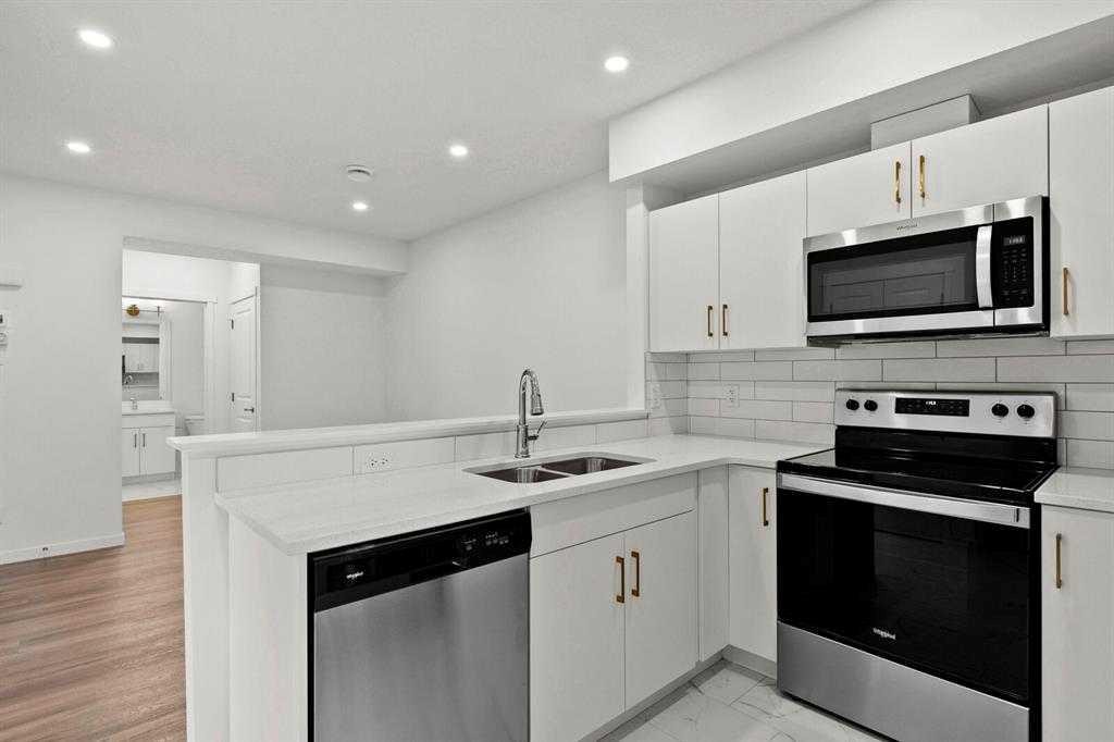 640 Masters Road Se, Calgary, AB - Indoor Photo Showing Kitchen With Double Sink