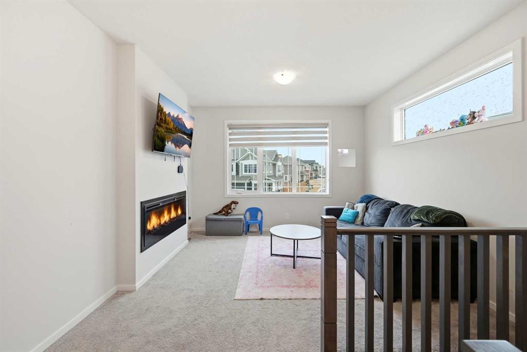 717 Windrow Manor Sw, Airdrie, AB - Indoor With Fireplace