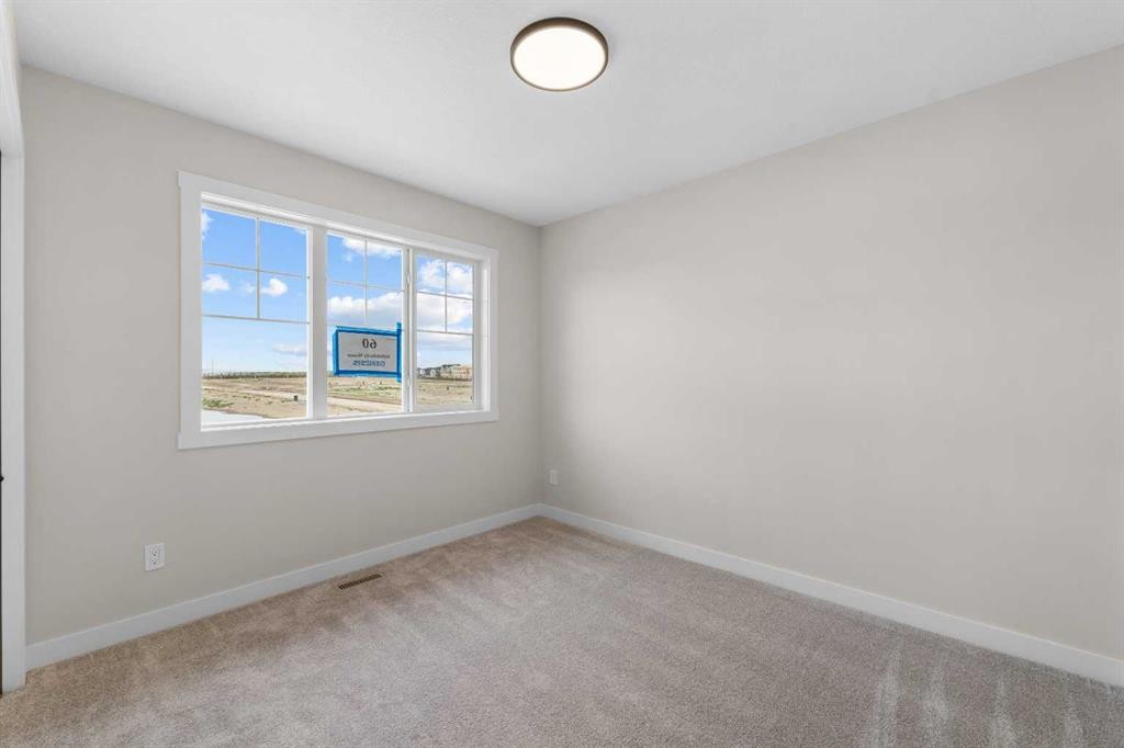 84 Buffaloberry Manor Se, Calgary, AB - Indoor Photo Showing Other Room