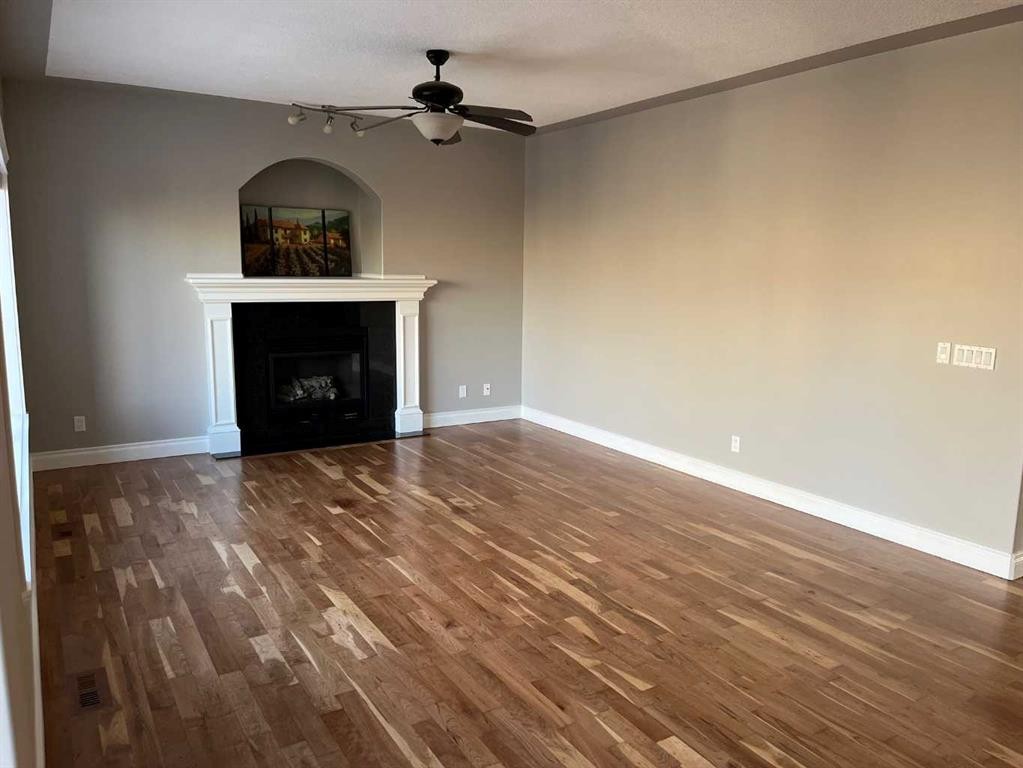 75 Royal Abbey Rise Nw, Calgary, AB - Indoor Photo Showing Other Room With Fireplace