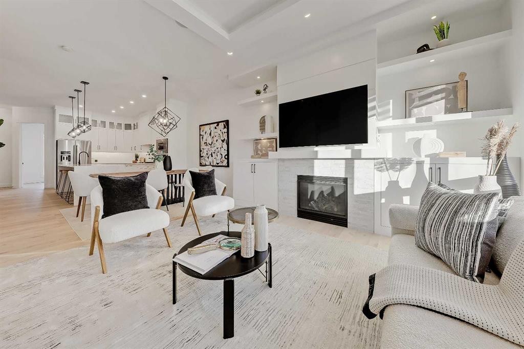 911 22 Avenue Nw, Calgary, AB - Indoor Photo Showing Living Room With Fireplace