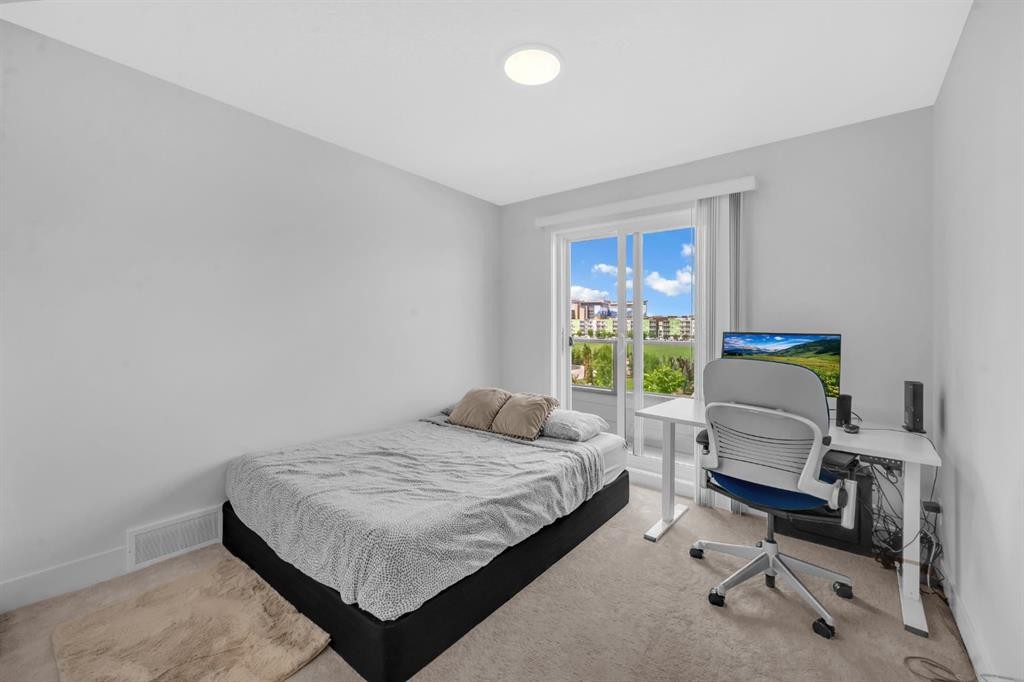4397 Seton Drive Se, Calgary, AB - Indoor Photo Showing Bedroom