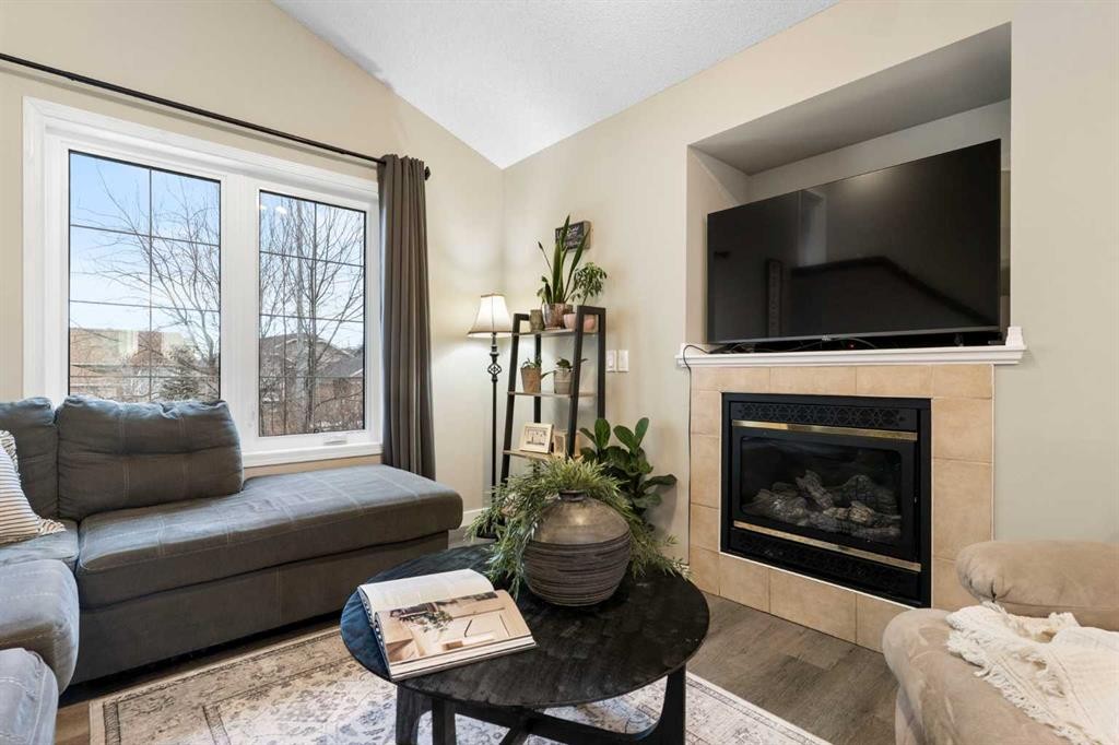 20 Willow Brook Crescent Nw, Airdrie, AB - Indoor Photo Showing Living Room With Fireplace