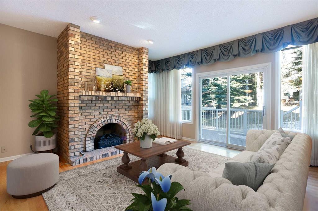 32-275 Woodridge Drive Sw, Calgary, AB - Indoor Photo Showing Living Room With Fireplace