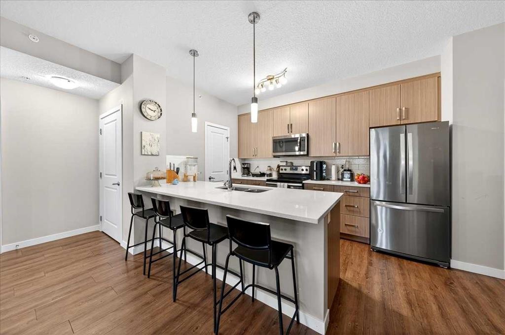 302-200 Cranfield Common Se, Calgary, AB - Indoor Photo Showing Kitchen With Upgraded Kitchen