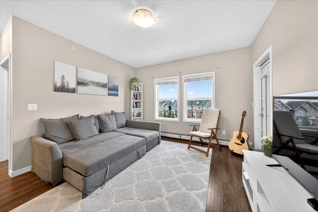 302-200 Cranfield Common Se, Calgary, AB - Indoor Photo Showing Living Room