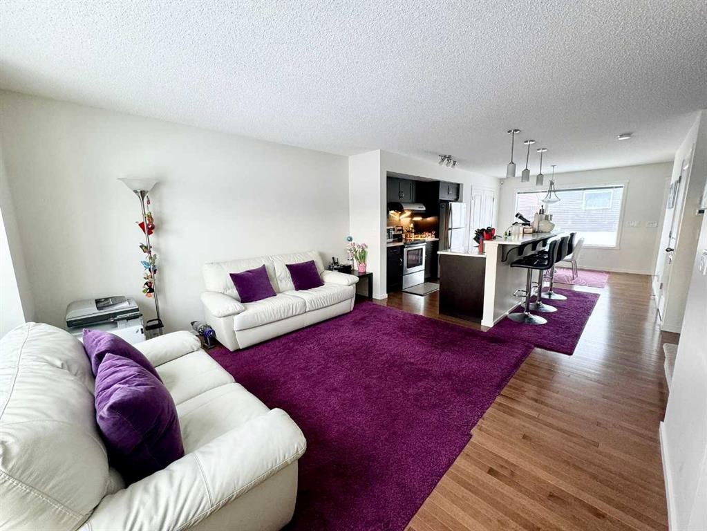 36 Evansborough Common Nw, Calgary, AB - Indoor Photo Showing Living Room