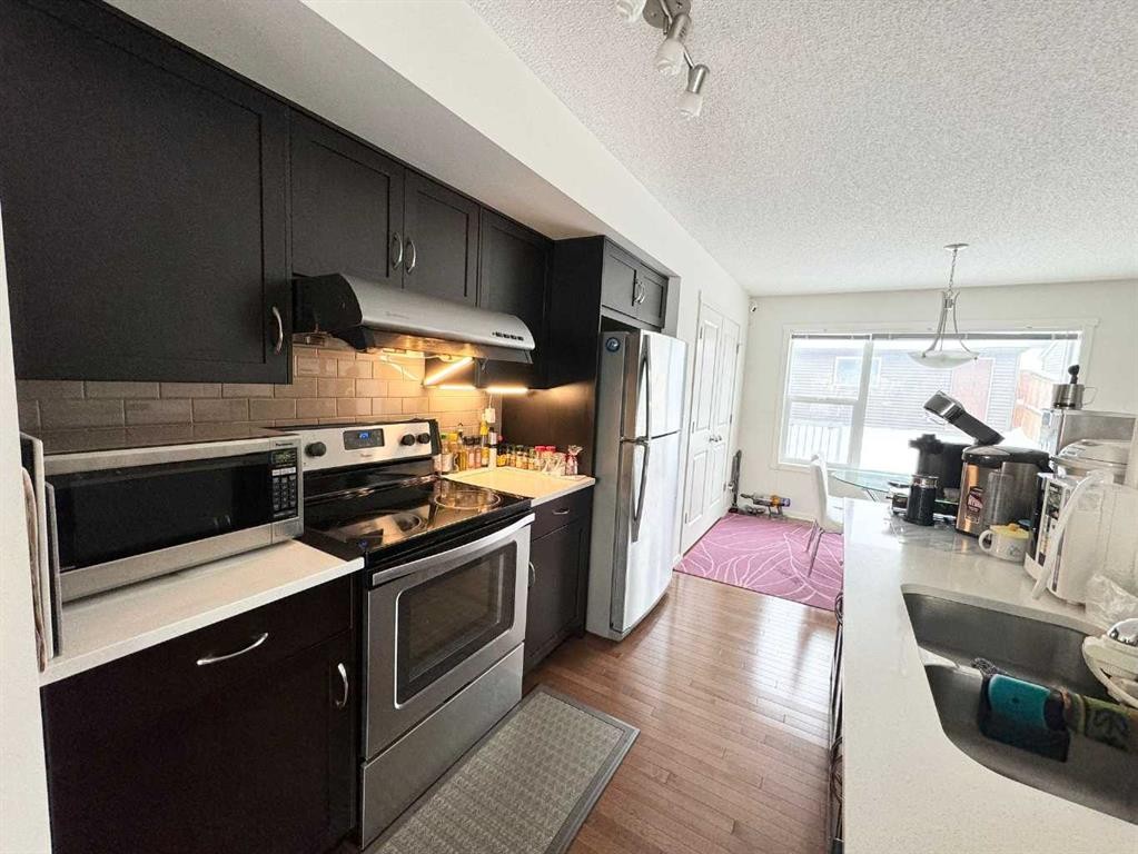 36 Evansborough Common Nw, Calgary, AB - Indoor Photo Showing Kitchen With Stainless Steel Kitchen