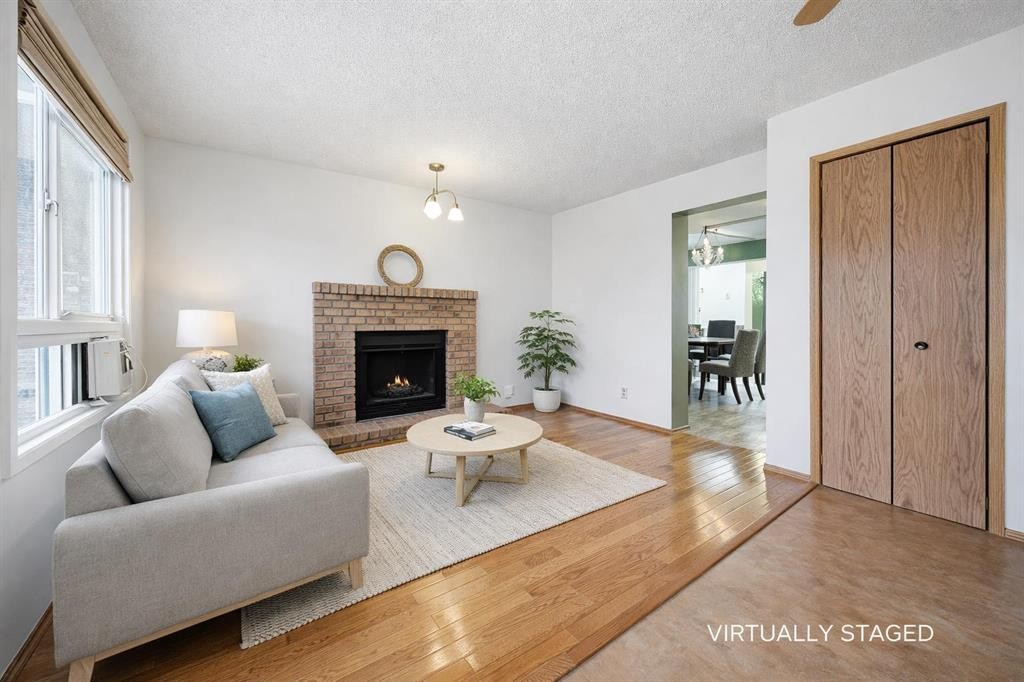 24 Laguna Close Ne, Calgary, AB - Indoor Photo Showing Living Room With Fireplace