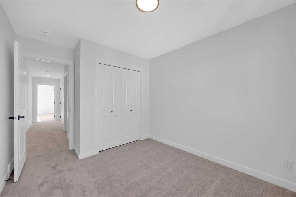 14 Versant Path Sw, Calgary, AB - Indoor Photo Showing Other Room