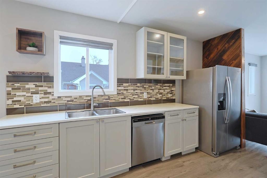 18 Maple Street, Okotoks, AB - Indoor Photo Showing Kitchen With Stainless Steel Kitchen With Double Sink