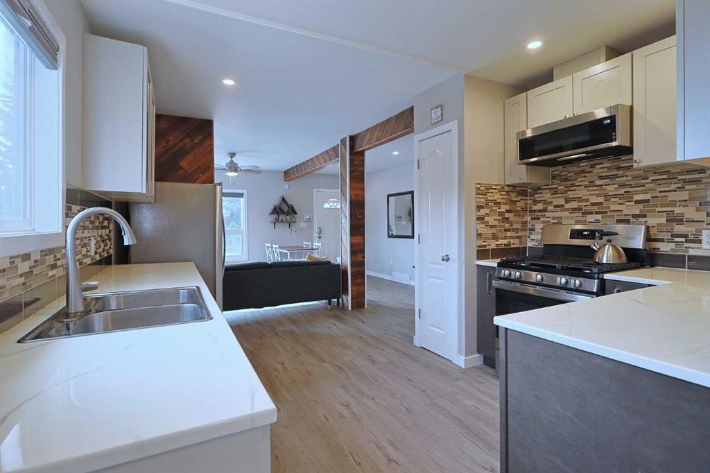 18 Maple Street, Okotoks, AB - Indoor Photo Showing Kitchen With Double Sink