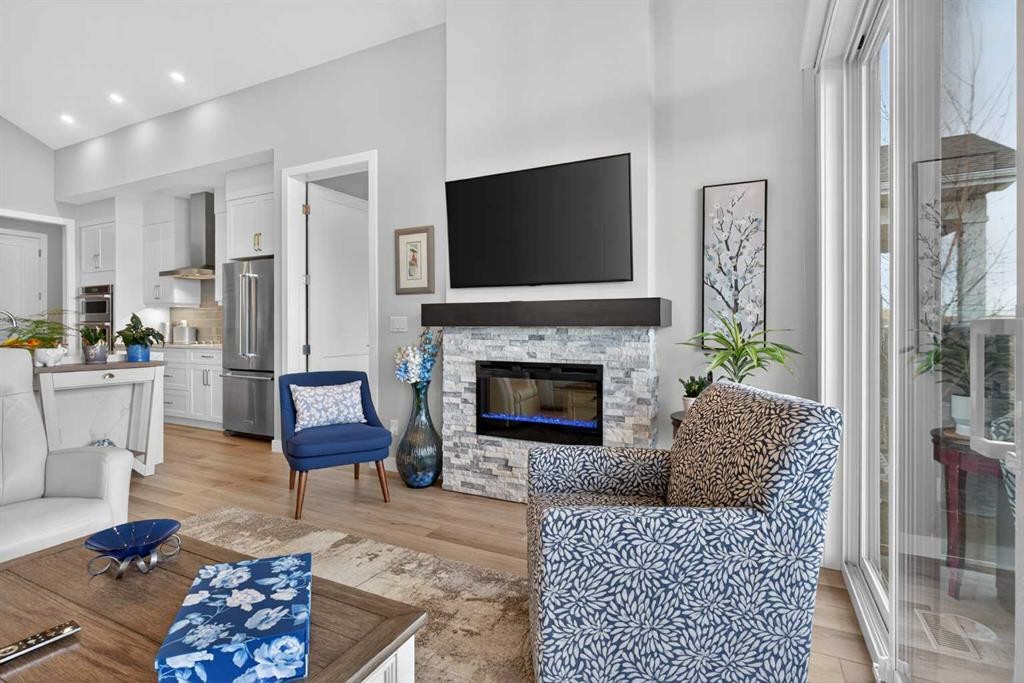 206 Crestridge Common Sw, Calgary, AB - Indoor Photo Showing Living Room With Fireplace